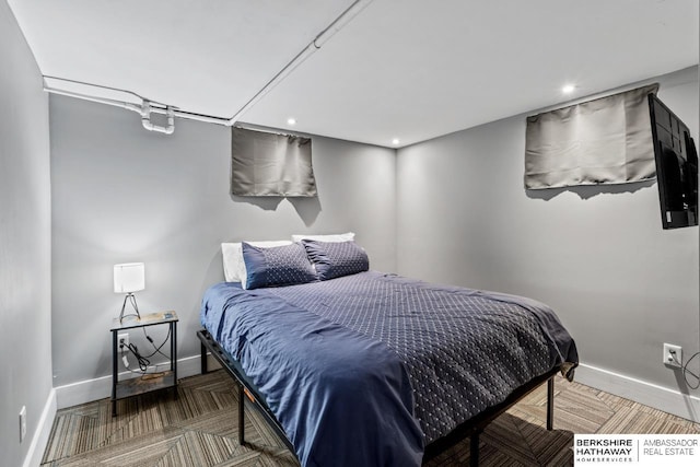 bedroom with recessed lighting and baseboards