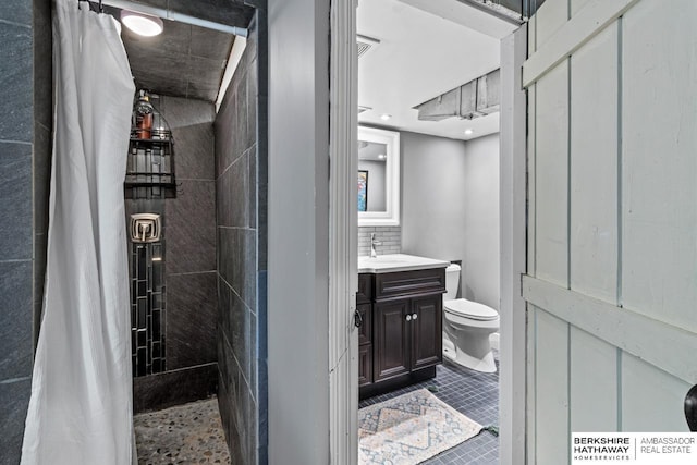 bathroom featuring toilet and vanity