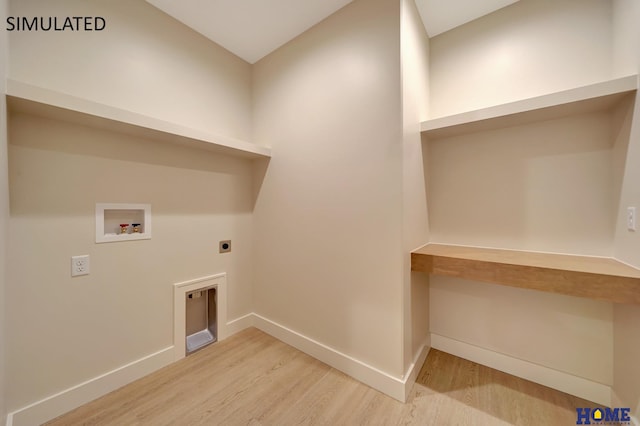 clothes washing area with wood finished floors, baseboards, hookup for an electric dryer, laundry area, and washer hookup