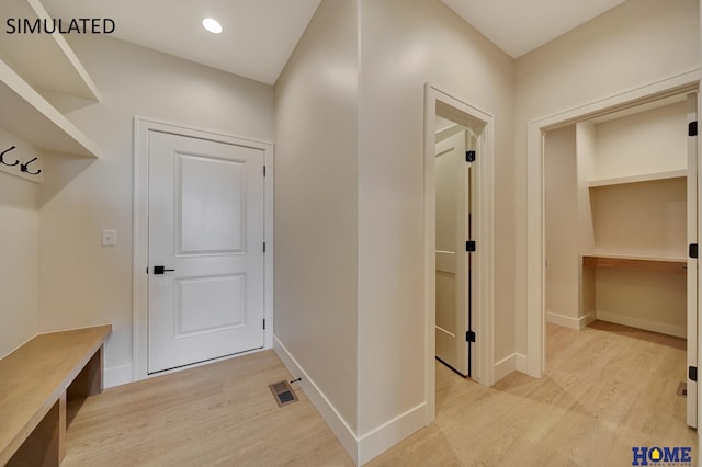 mudroom with recessed lighting, visible vents, baseboards, and light wood-style flooring