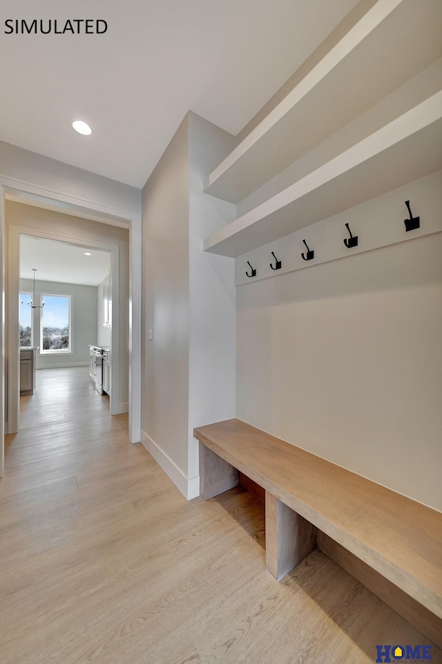 mudroom with recessed lighting, baseboards, and light wood finished floors