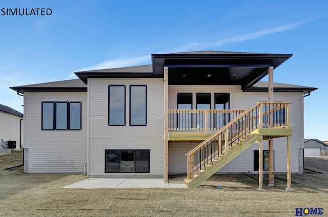 rear view of house with cooling unit, a lawn, stairs, and a patio area