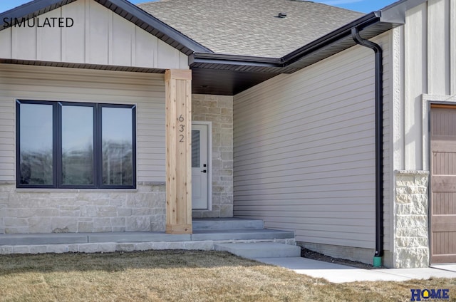 property entrance featuring stone siding, board and batten siding, and a shingled roof