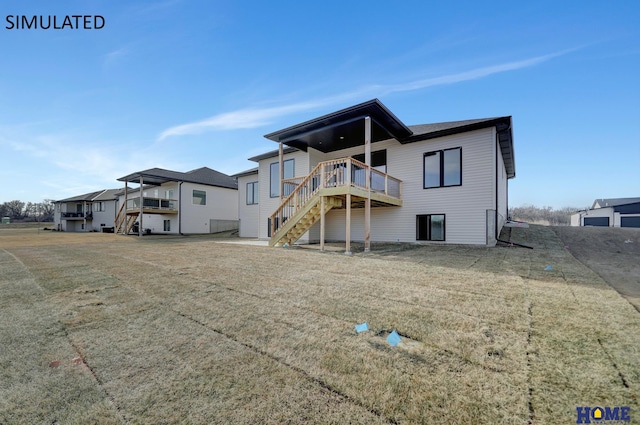 rear view of house with stairway and a deck