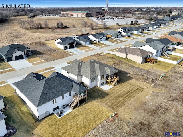 birds eye view of property with a residential view