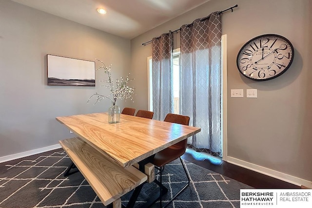 dining space with recessed lighting, baseboards, and dark wood-type flooring