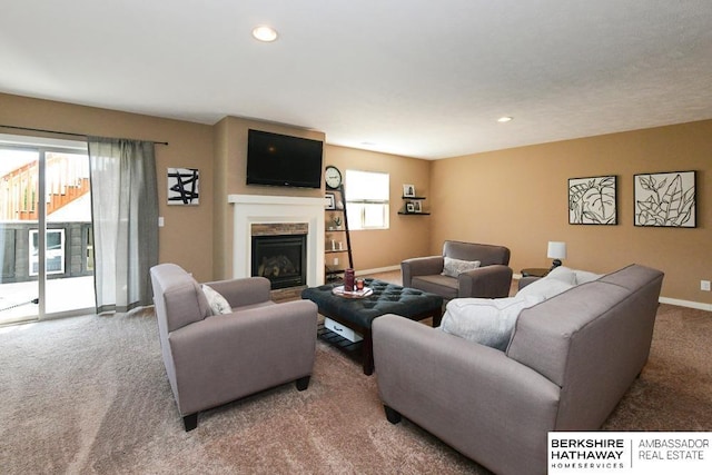 living room featuring recessed lighting, baseboards, a fireplace, and carpet flooring