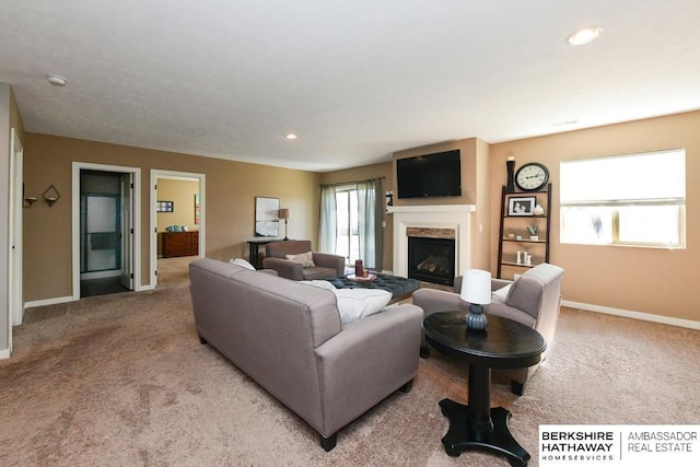 living area featuring recessed lighting, a fireplace, baseboards, and carpet floors