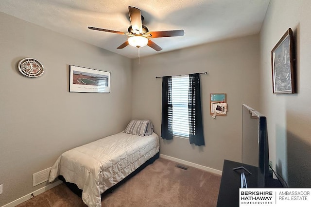 bedroom featuring carpet flooring, visible vents, baseboards, and ceiling fan