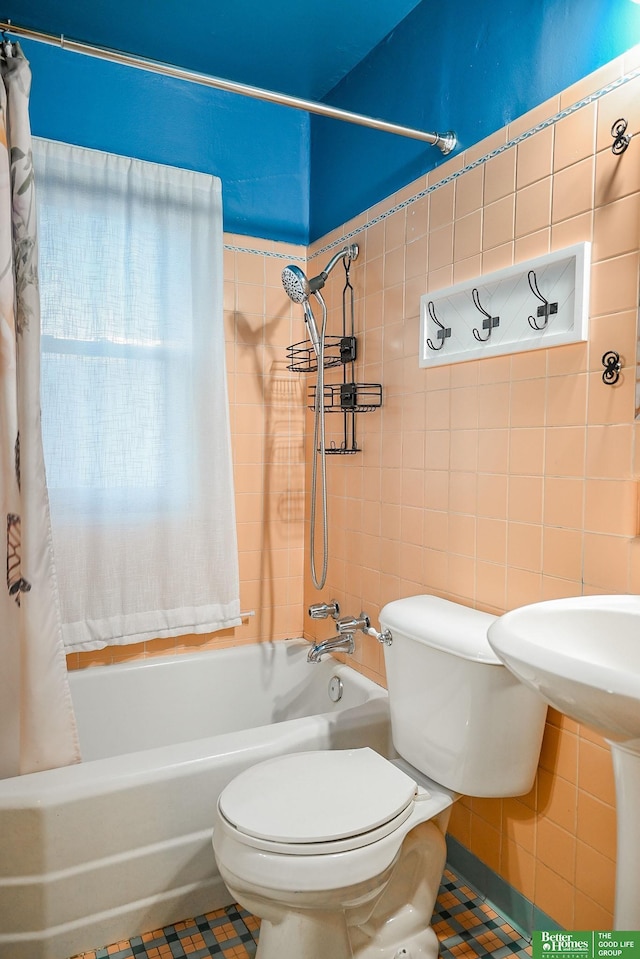 bathroom featuring toilet, tile walls, shower / tub combo with curtain, and tile patterned flooring