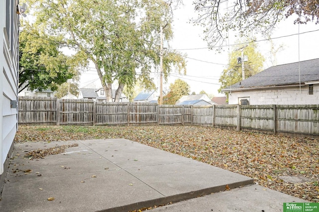 view of yard featuring a patio and a fenced backyard