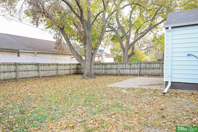 view of yard featuring a patio area and a fenced backyard