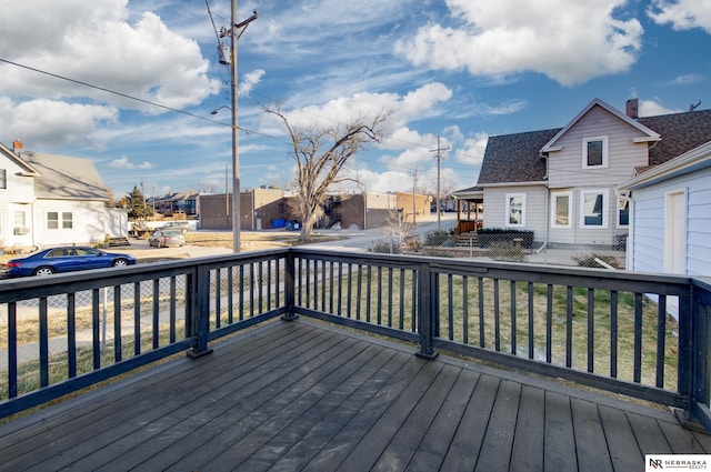 wooden terrace featuring a residential view