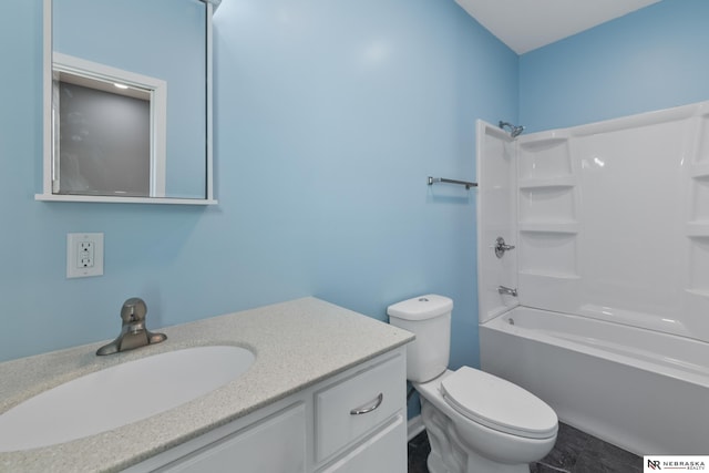 bathroom featuring vanity, toilet, and bathtub / shower combination