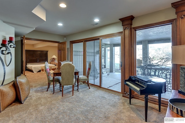 dining area with light carpet, visible vents, and recessed lighting