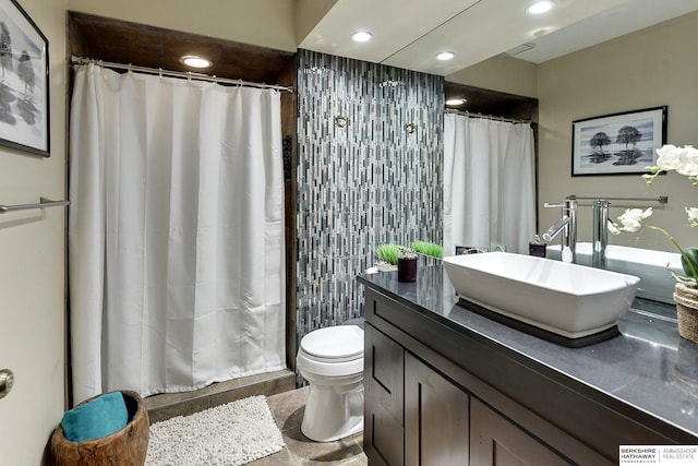 bathroom with recessed lighting, toilet, a shower with shower curtain, and vanity