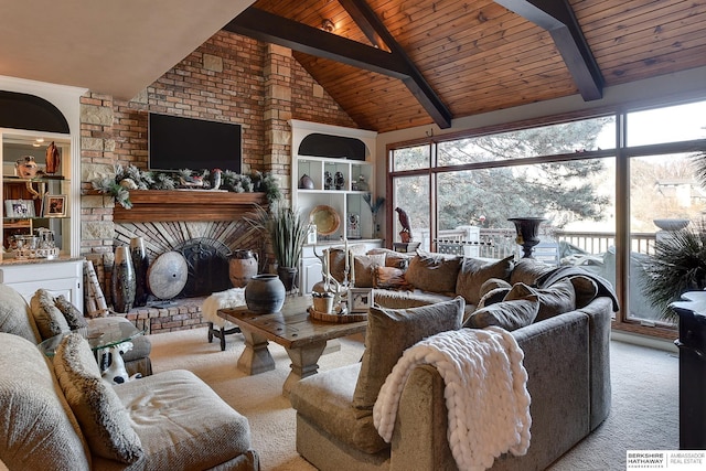 carpeted living room with plenty of natural light, beam ceiling, and a fireplace