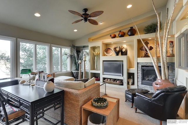 carpeted living area featuring lofted ceiling, recessed lighting, a fireplace, and ceiling fan