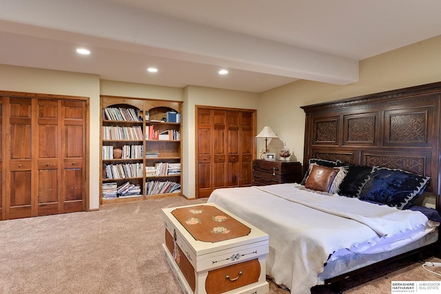 bedroom featuring beamed ceiling, recessed lighting, and light carpet