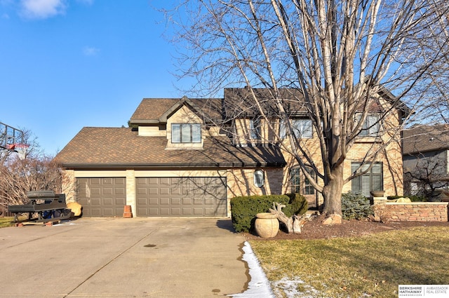 view of front of home with brick siding, concrete driveway, an attached garage, and a shingled roof