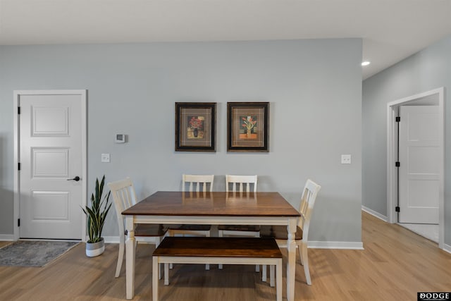 dining space with recessed lighting, light wood-style floors, and baseboards