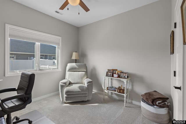 office area with visible vents, baseboards, carpet, and ceiling fan