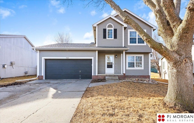 traditional-style home with a garage and driveway