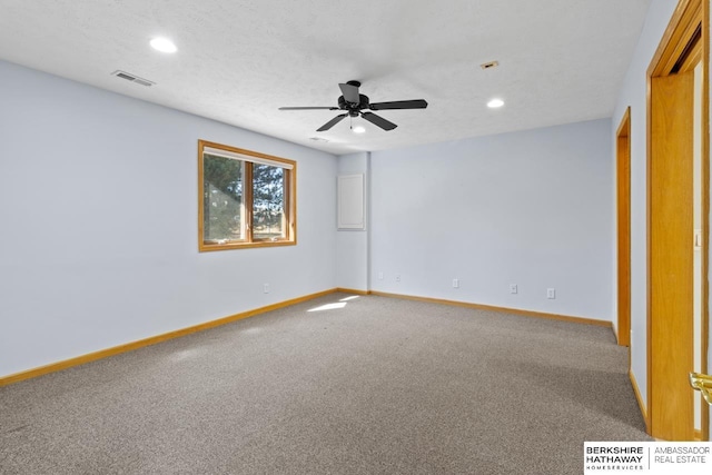 carpeted spare room featuring recessed lighting, visible vents, baseboards, and ceiling fan