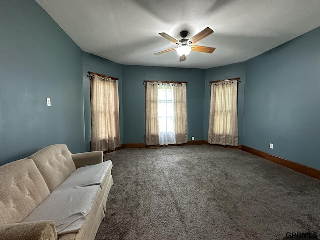 unfurnished room with baseboards, carpet, and ceiling fan