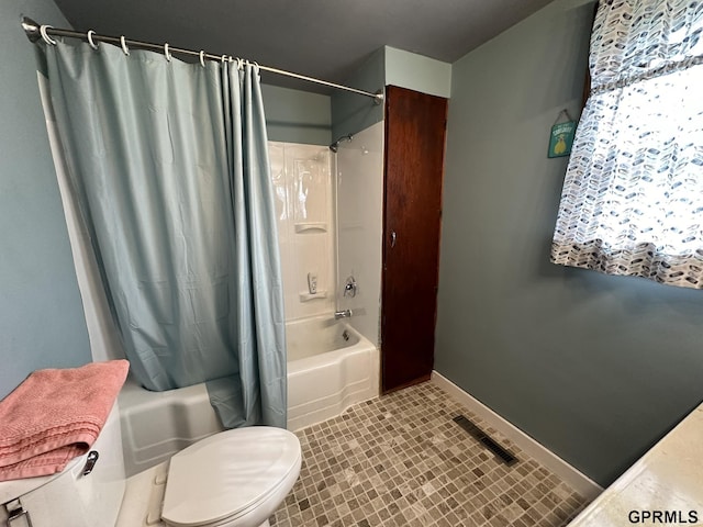 bathroom featuring tile patterned flooring, visible vents, baseboards, toilet, and shower / tub combo with curtain