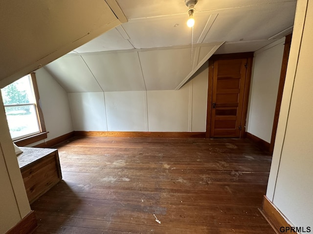 bonus room featuring baseboards, wood-type flooring, and vaulted ceiling