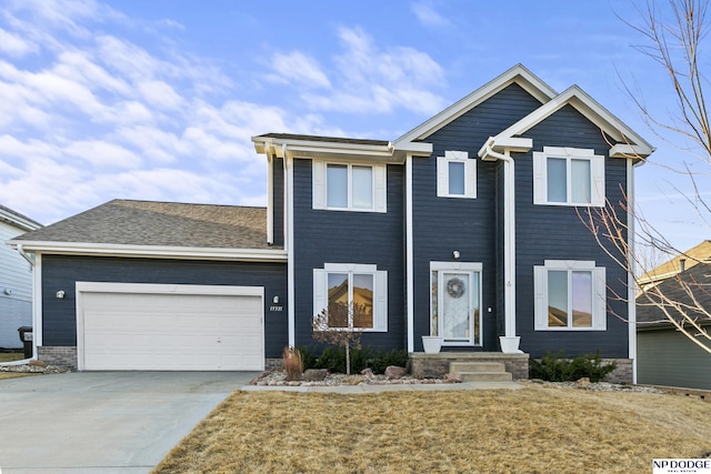 view of front of home featuring driveway and an attached garage