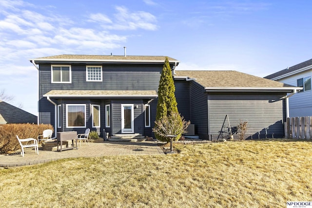 rear view of house featuring a patio area, central AC, and fence