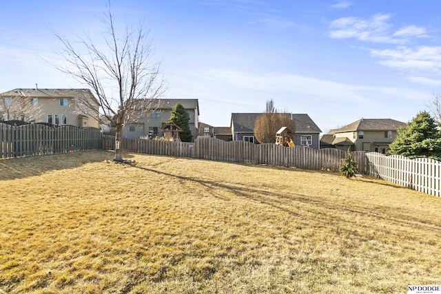 view of yard featuring a residential view and fence private yard