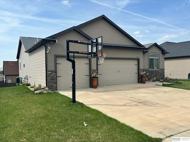 view of side of property with stucco siding, stone siding, a garage, and a yard