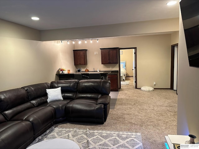 living room featuring recessed lighting and light colored carpet