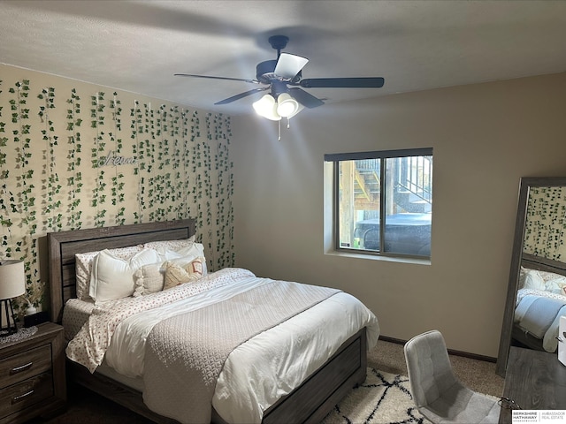 bedroom featuring baseboards, carpet floors, and ceiling fan