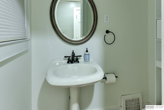 bathroom with a sink and visible vents