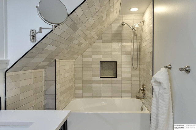 bathroom with vanity and  shower combination