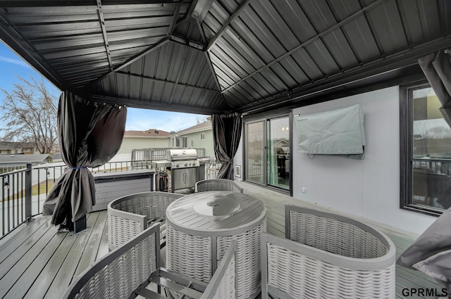 wooden terrace featuring grilling area