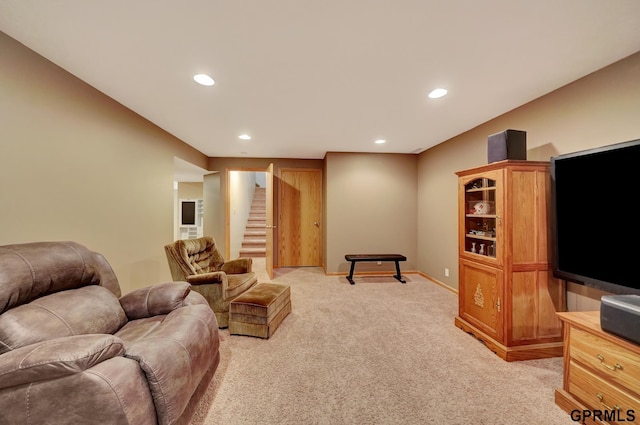 living area with light carpet, stairway, recessed lighting, and baseboards