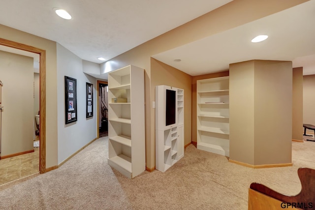 hall featuring recessed lighting, built in features, baseboards, and carpet floors