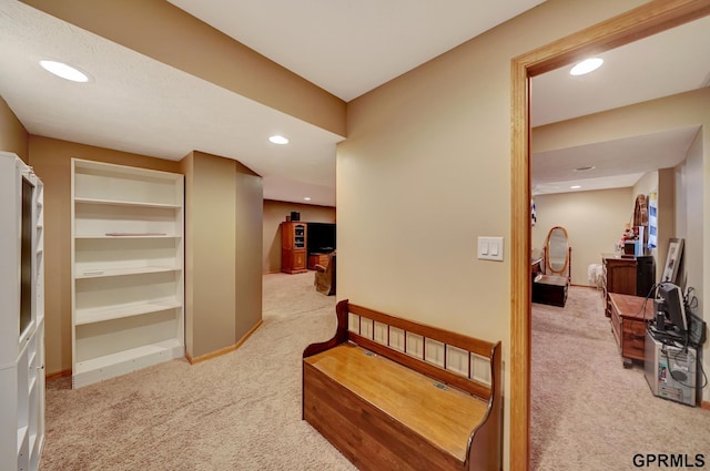 corridor with carpet flooring, recessed lighting, and baseboards