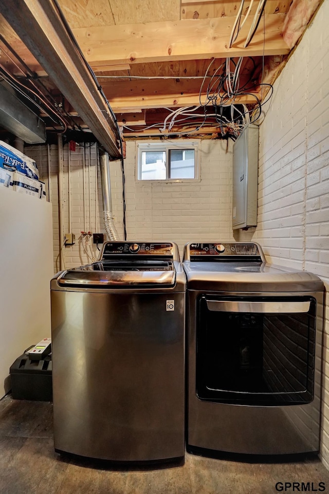 washroom featuring laundry area and separate washer and dryer