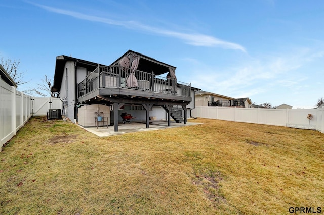 back of property featuring a wooden deck, a fenced backyard, stairs, a patio area, and a lawn