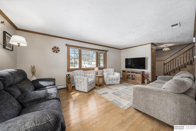 living area with visible vents, stairs, light wood-type flooring, ornamental molding, and a textured ceiling