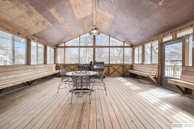 unfurnished sunroom with lofted ceiling and wooden ceiling