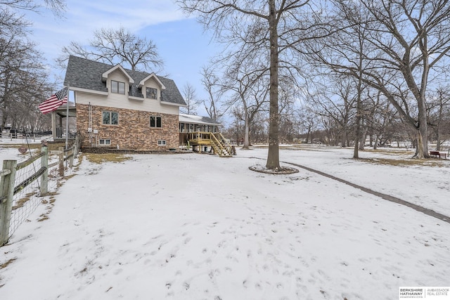 exterior space with a deck and fence