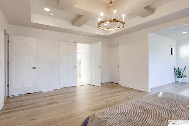 unfurnished bedroom featuring a chandelier, recessed lighting, baseboards, and light wood-style floors