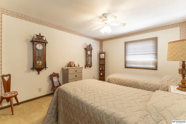 bedroom with light carpet, a ceiling fan, and baseboards